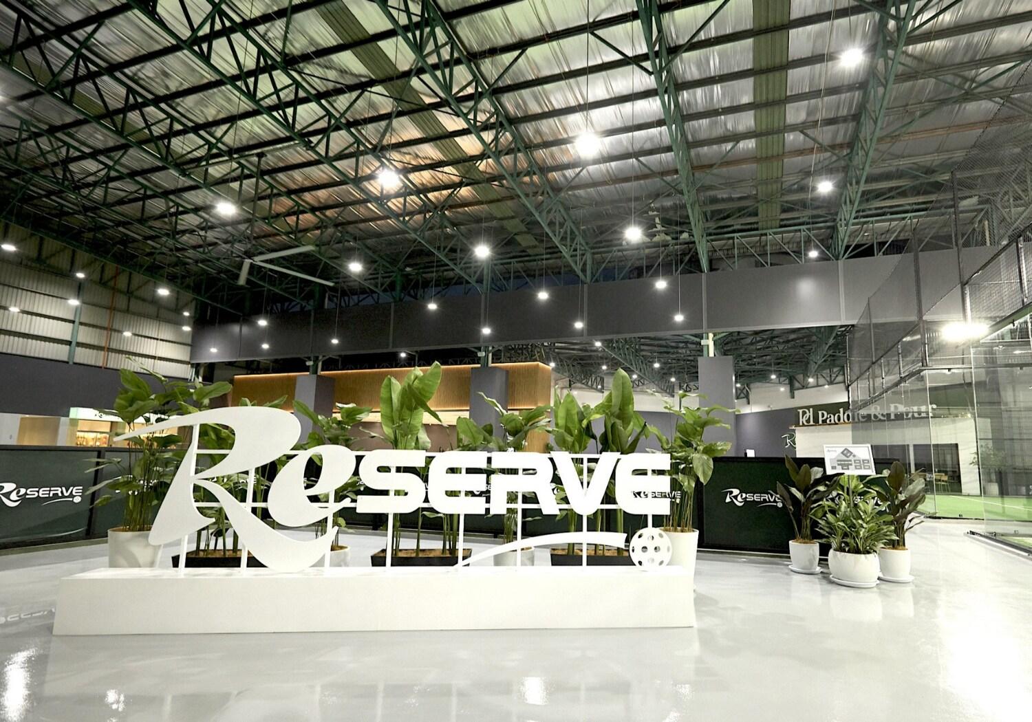 Interior of Reserve Pickle & Padel Kota Damansara featuring the Reserve sign, indoor courts, and modern open facility design